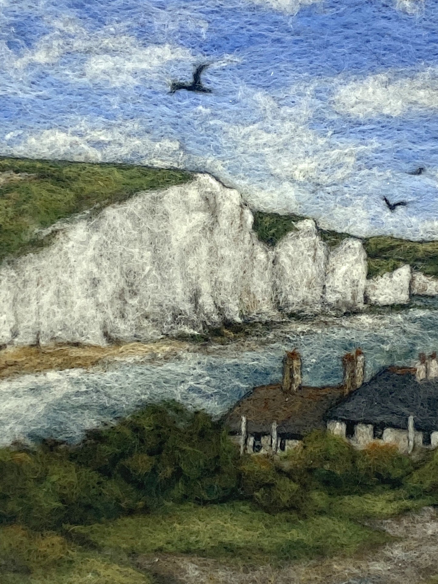 needle felted picture in a white wooden box frame, of a view of Cuckemere Haven and the Seven Sisters cliffs