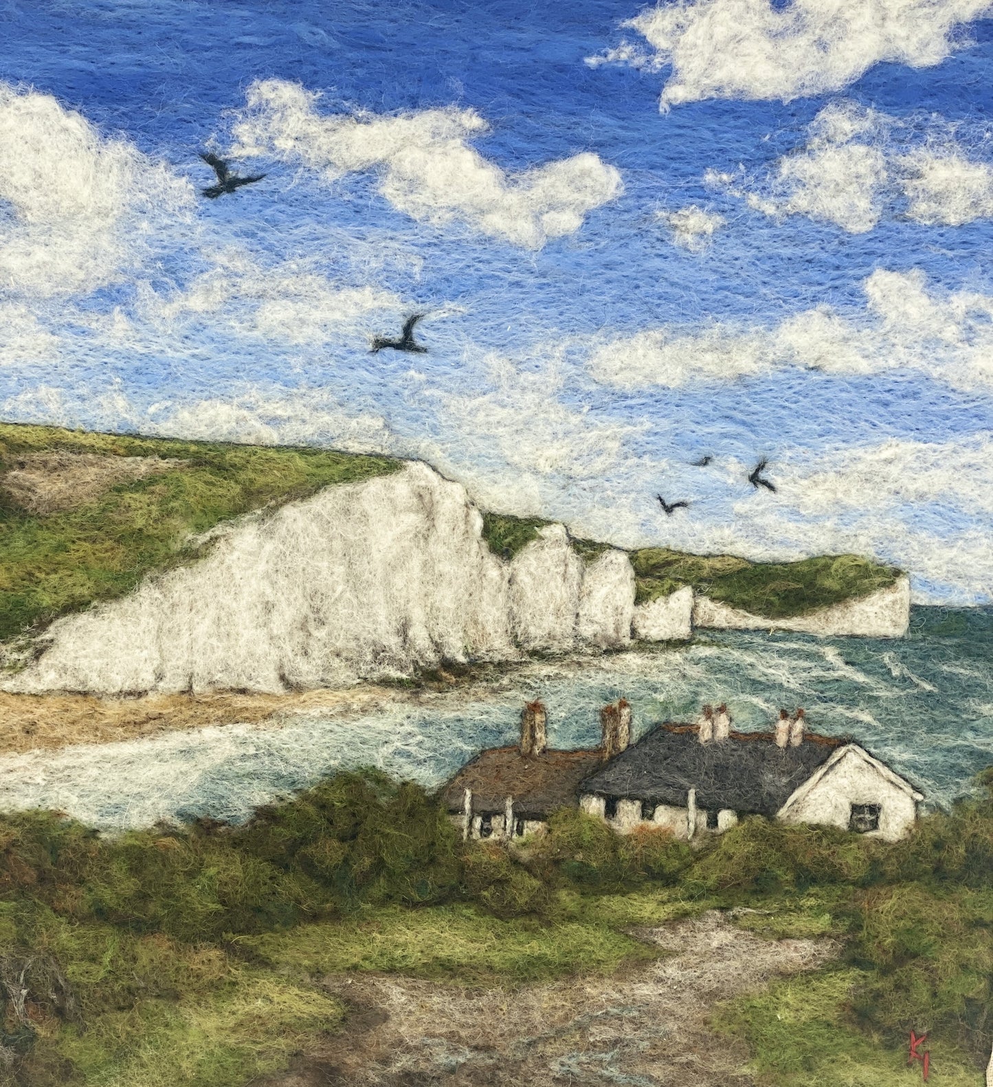 needle felted picture in a white wooden box frame, of a view of Cuckemere Haven and the Seven Sisters cliffs