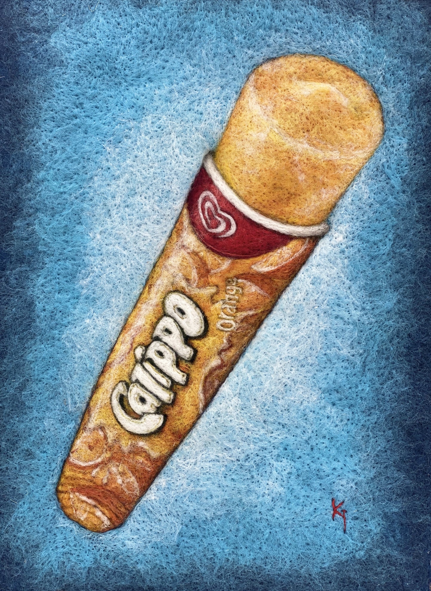 a white box framed needle felted study of an orange flavoured Calippo ice lolly on a blue background
