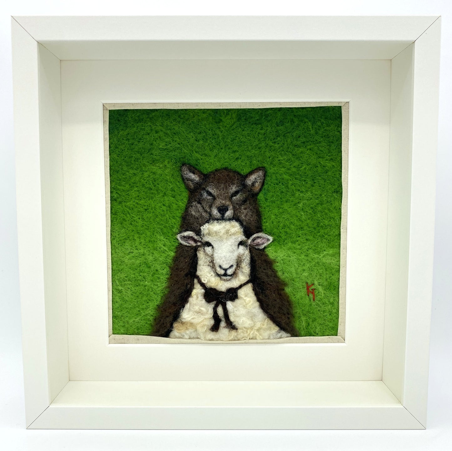 a needle felted portrait of a sheep in a wolf costume with a green background