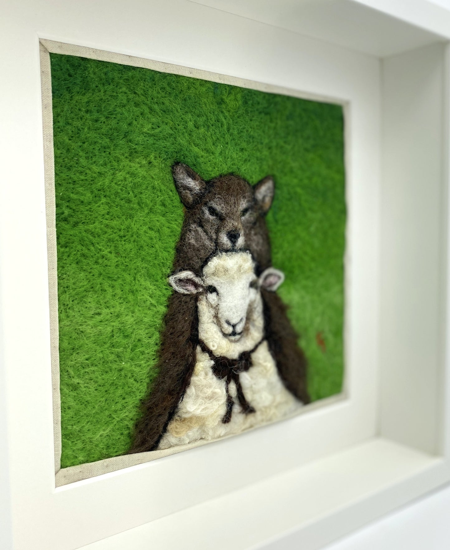 a needle felted portrait of a sheep in a wolf costume with a green background