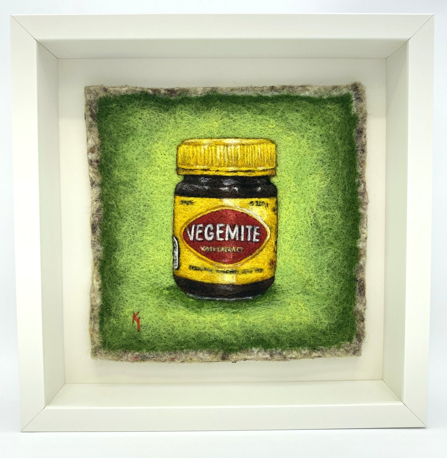 needle felted framed picture of a pot of Vegemite on a green background
