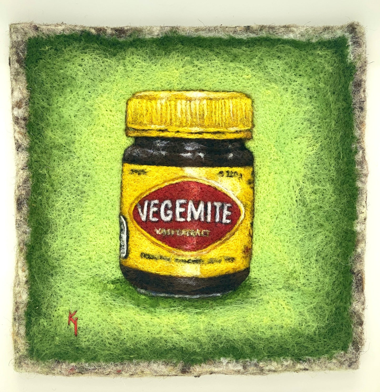 needle felted framed picture of a pot of Vegemite on a green background