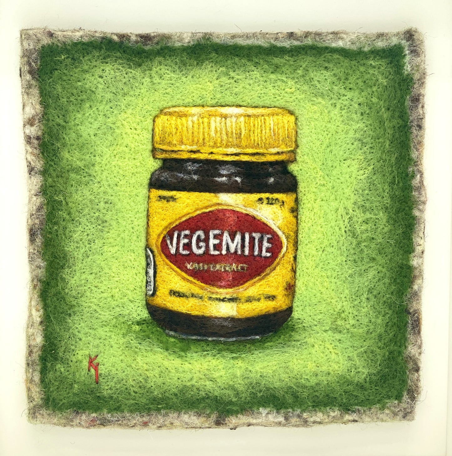 needle felted framed picture of a pot of Vegemite on a green background