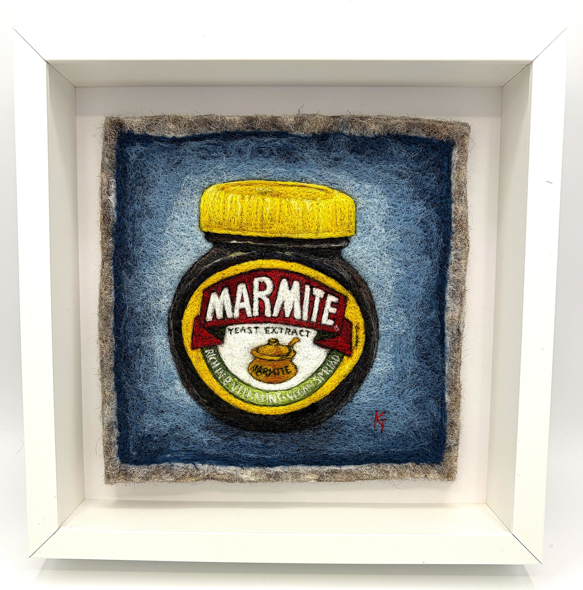 Needle felted framed picture of a pot of Marmite on a blue background