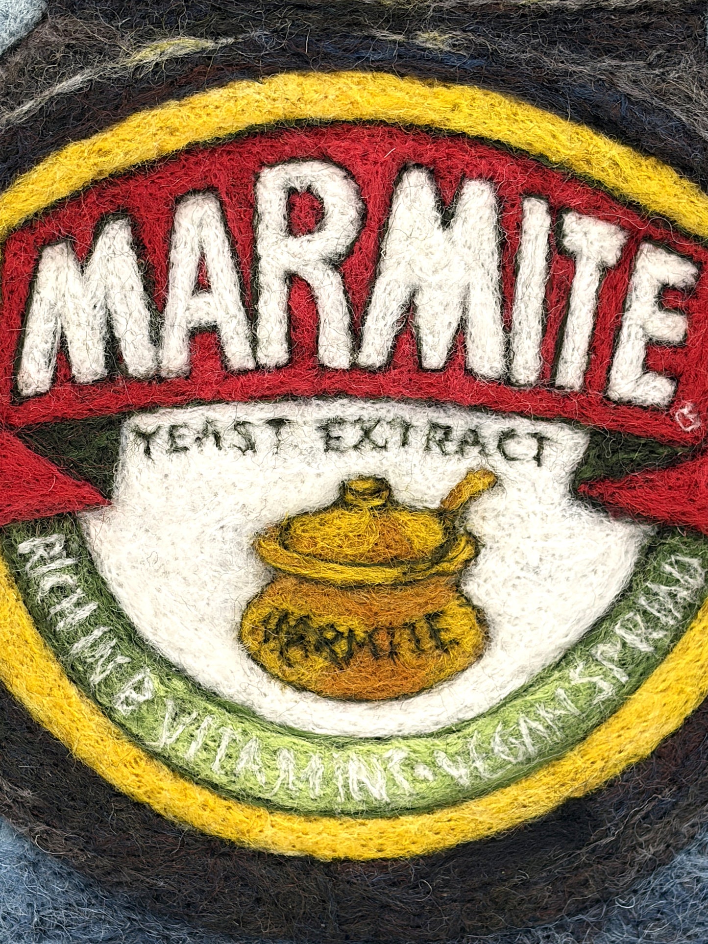 Needle felted framed picture of a pot of Marmite on a blue background