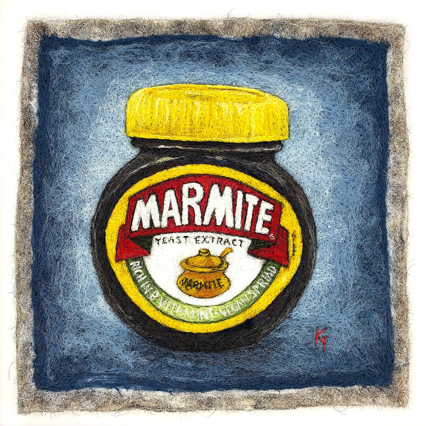 Needle felted framed picture of a pot of Marmite on a blue background