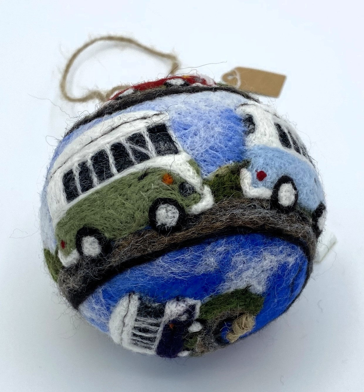 needle felted bauble depicting a convoy of seven VW style camper vans in a rainbow of colour, spiralling across the surface