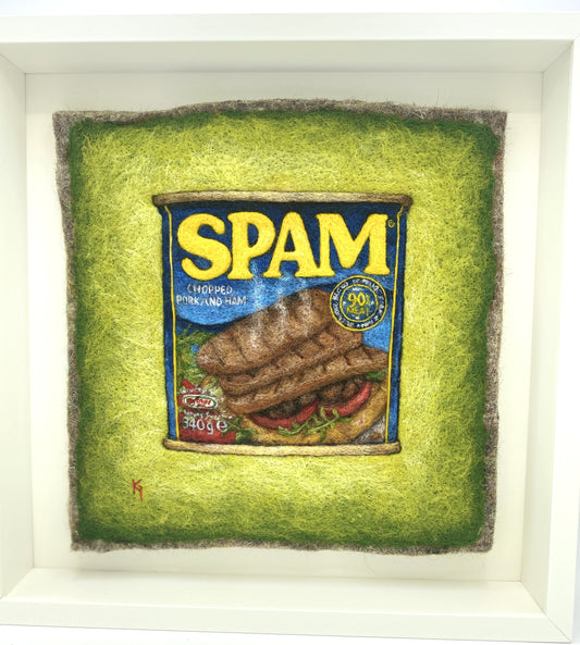 a needle felted picture of a can of Spam on a green background