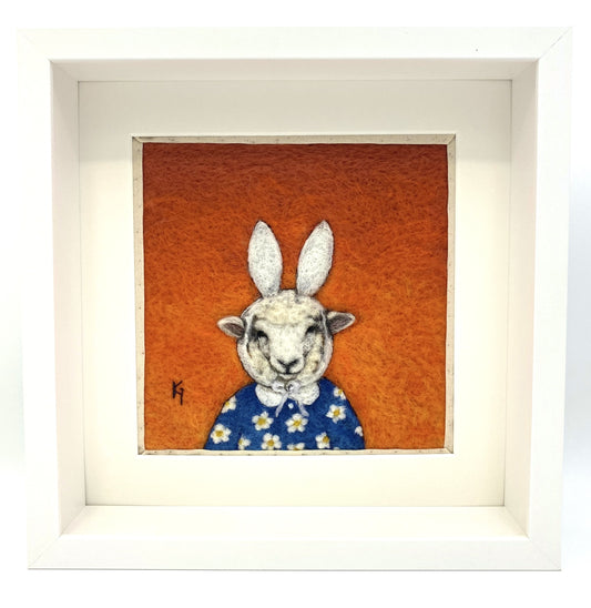 Needle felted picture of a sheep dressed as Miffy in her birthday dress, with an orange  background