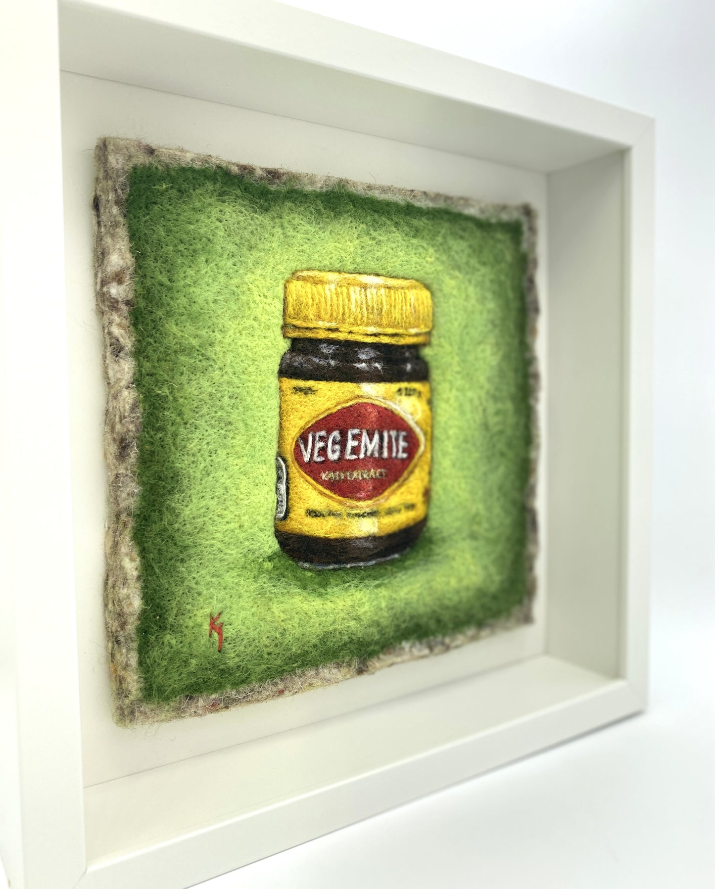 needle felted framed picture of a pot of Vegemite on a green background