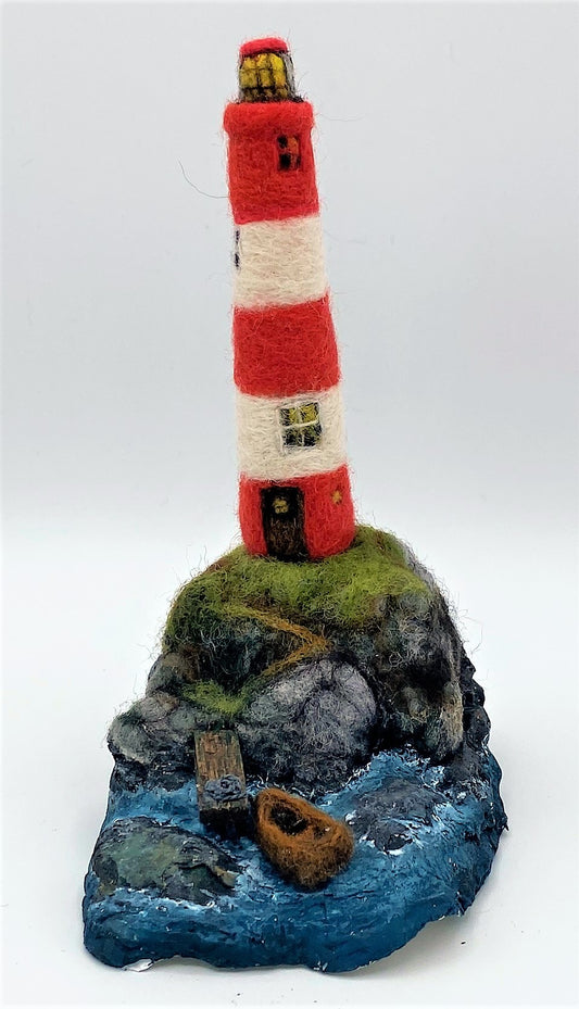 needle felted lighthouse, rocks, boat, jetty, path to front door, sea, grass, painted waves, on oyster shell base 